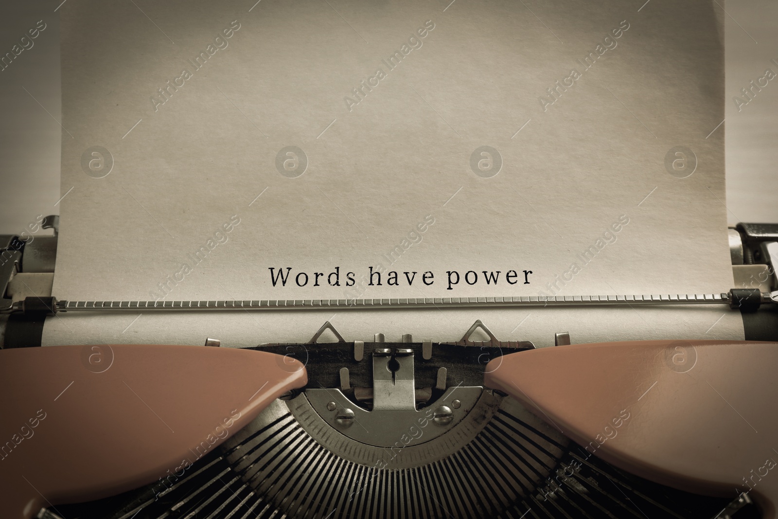 Image of Typewriter with sheet of paper, closeup. Typed text Words Have Power