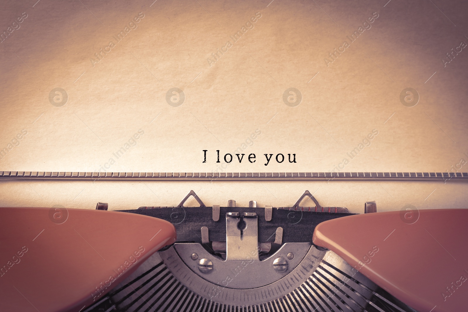 Image of Typewriter with sheet of paper, closeup. Typed text I Love You