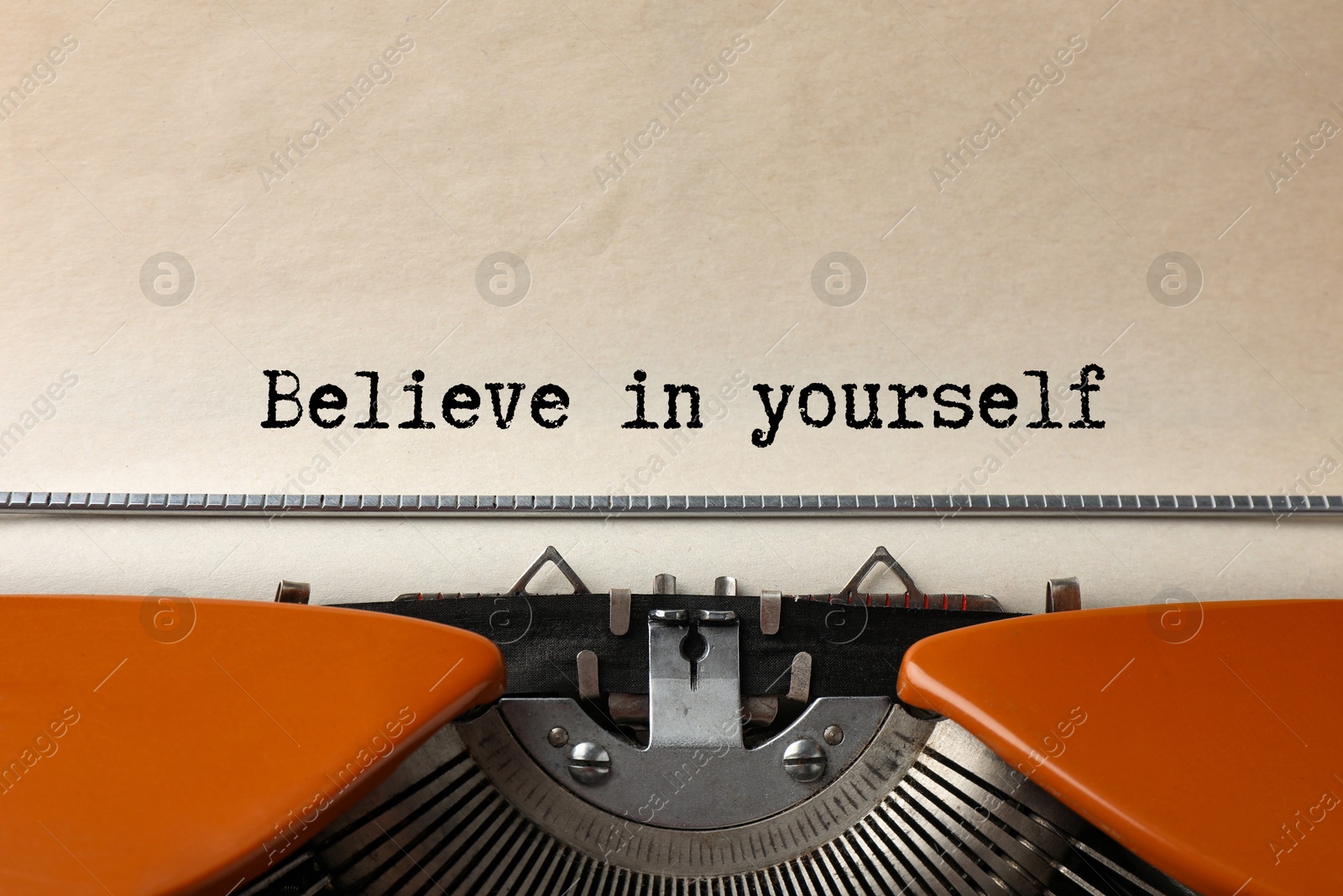 Image of Typewriter with sheet of paper, closeup. Typed text Believe In Yourself