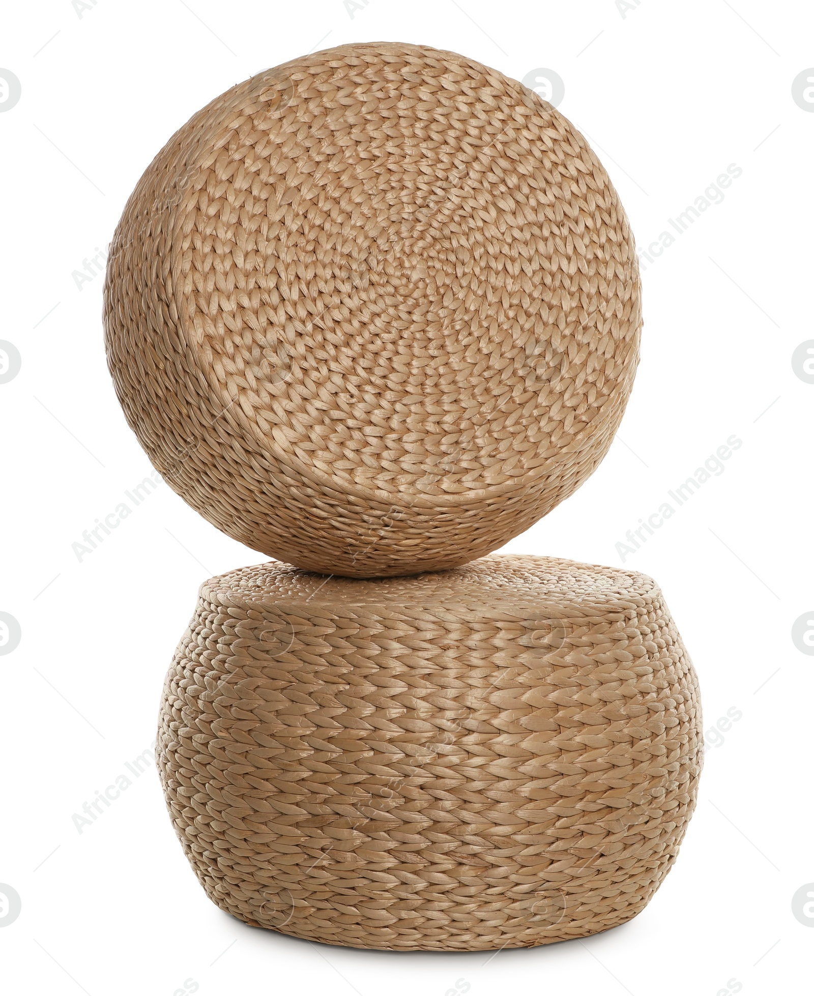 Photo of Two stylish wicker poufs on white background