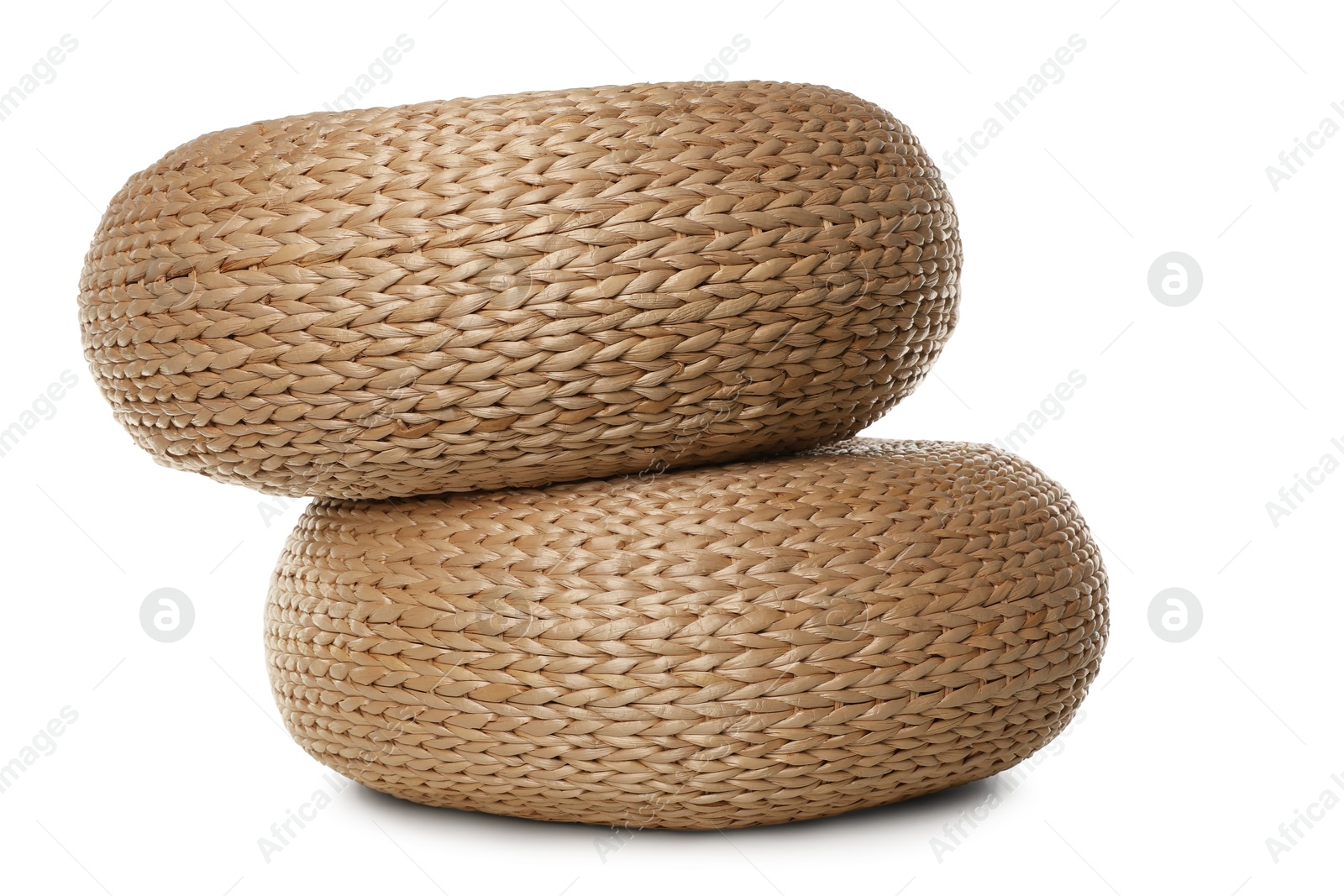 Photo of Two stylish wicker poufs on white background