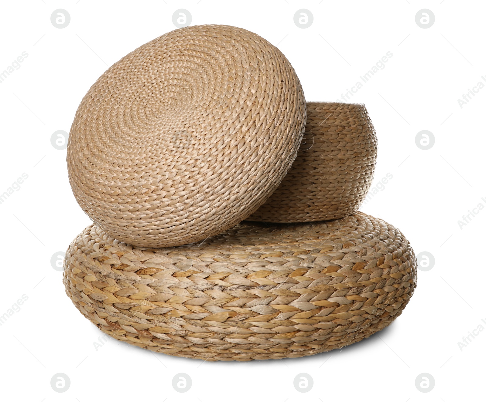 Photo of Three stylish wicker poufs on white background