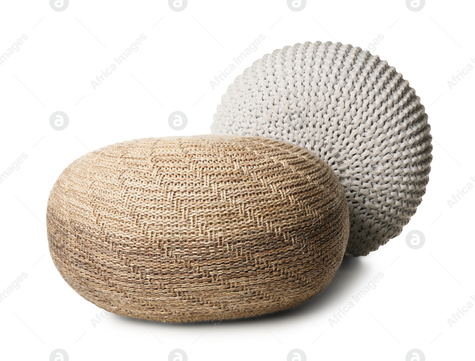 Photo of Different stylish knitted poufs on white background