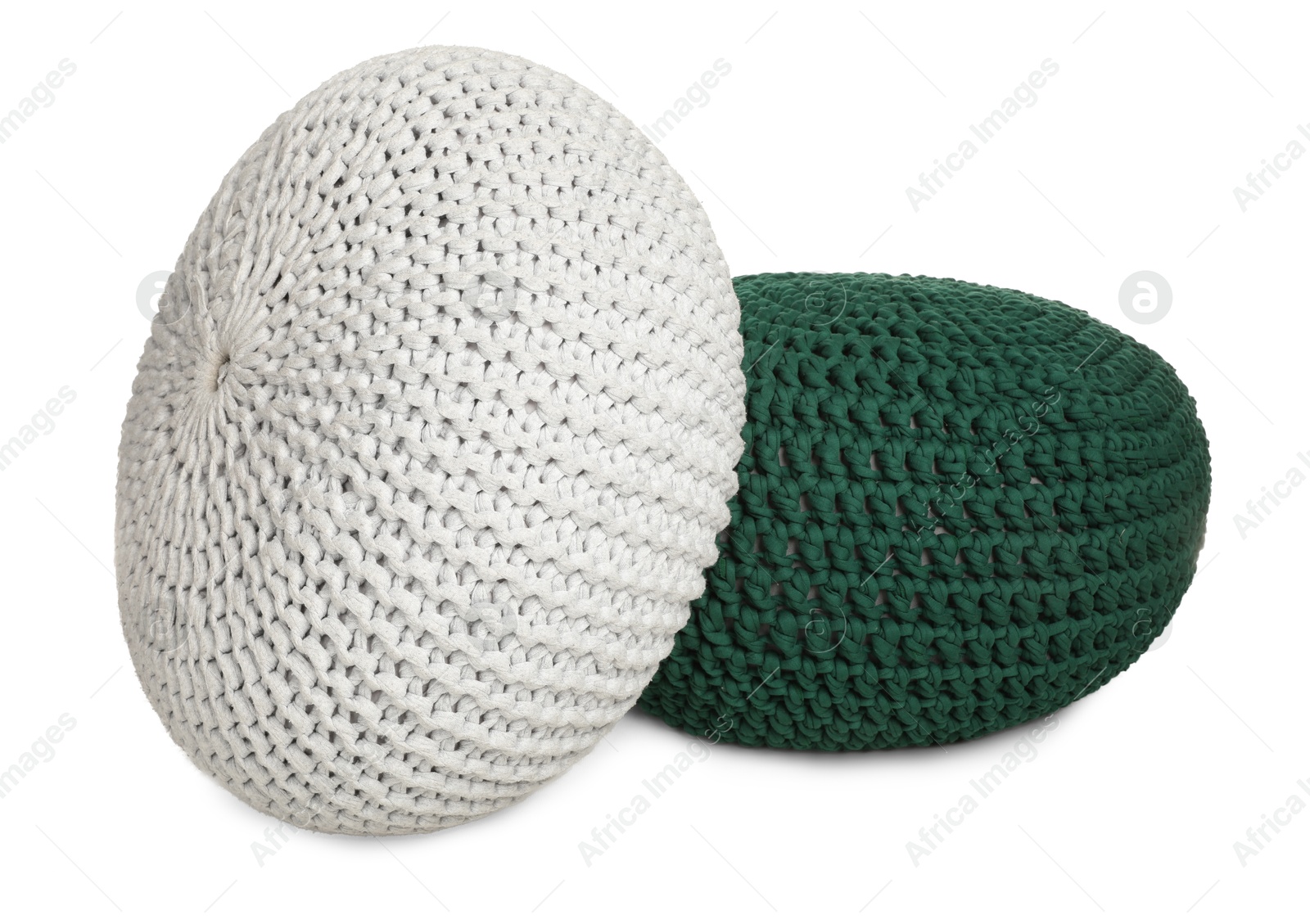 Photo of Different stylish knitted poufs on white background