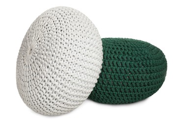 Photo of Different stylish knitted poufs on white background