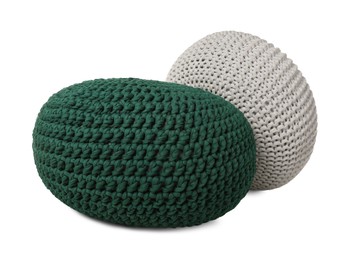 Photo of Different stylish knitted poufs on white background