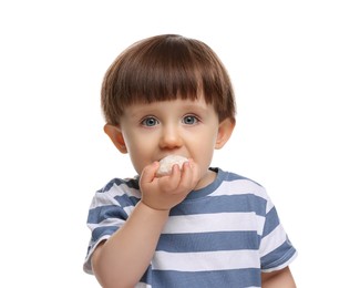 Photo of Cute little child eating tasty mochi on white background