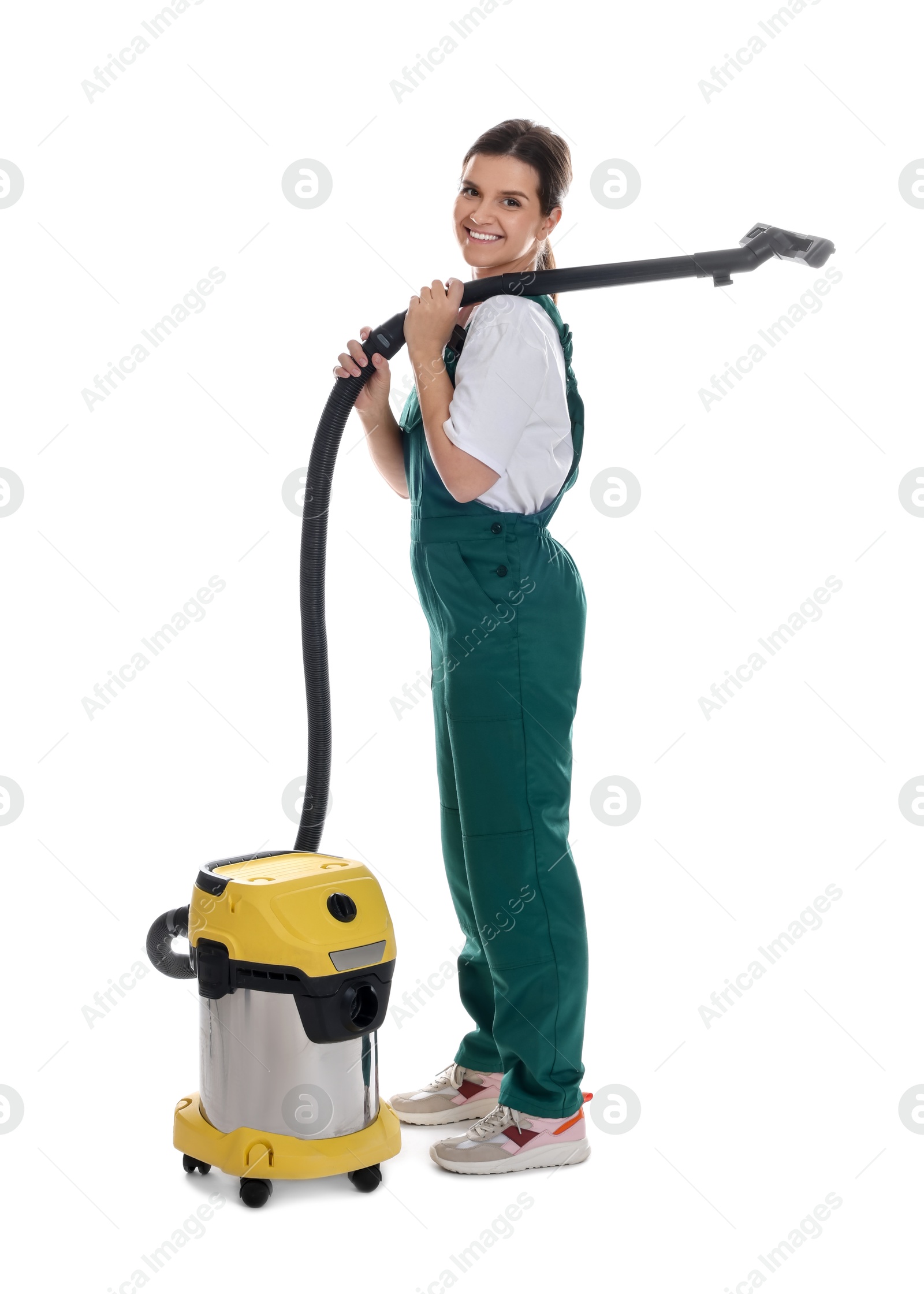 Photo of Smiling cleaning service worker with vacuum cleaner on white background