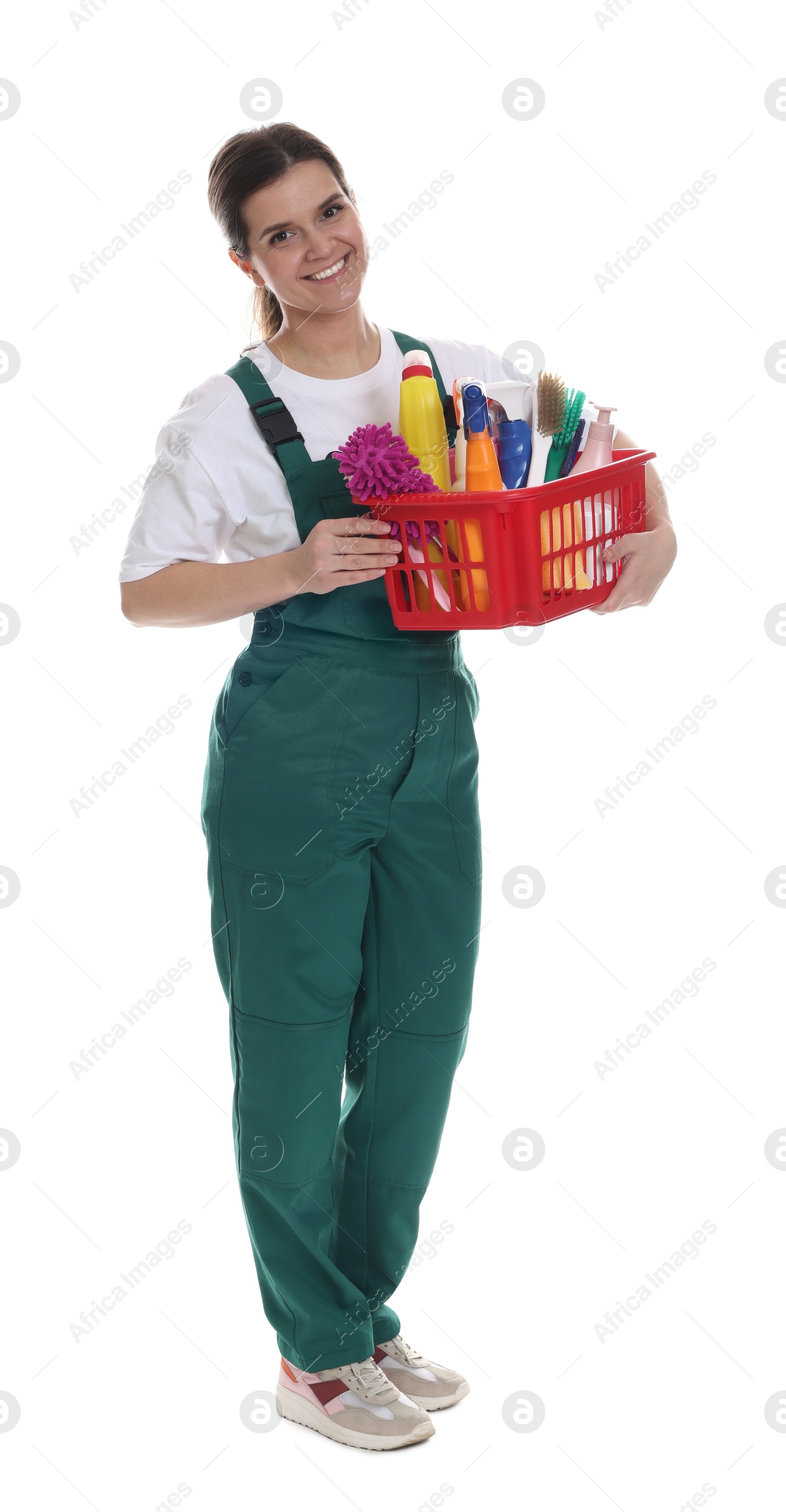 Photo of Smiling cleaning service worker with supplies on white background