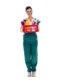 Photo of Smiling cleaning service worker with supplies on white background