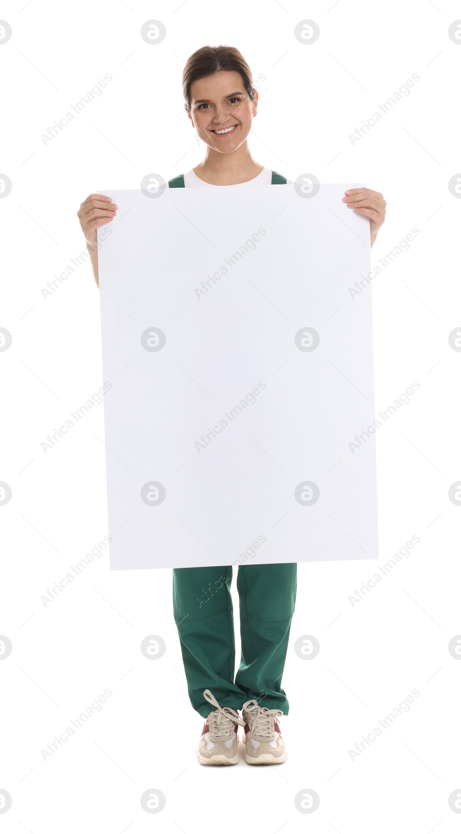 Photo of Smiling cleaning service worker with sheet of paper on white background. Space for text