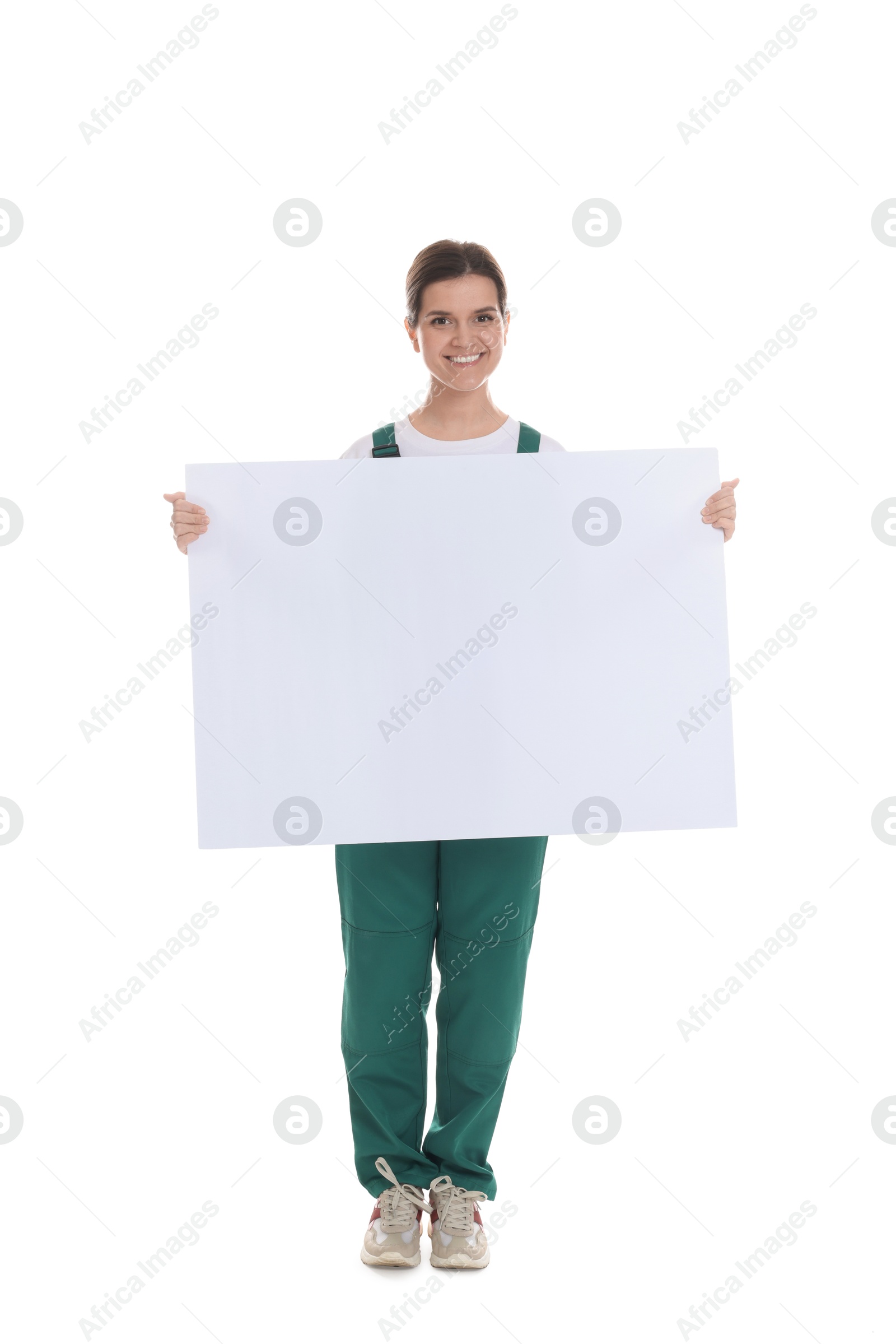 Photo of Smiling cleaning service worker with sheet of paper on white background. Space for text