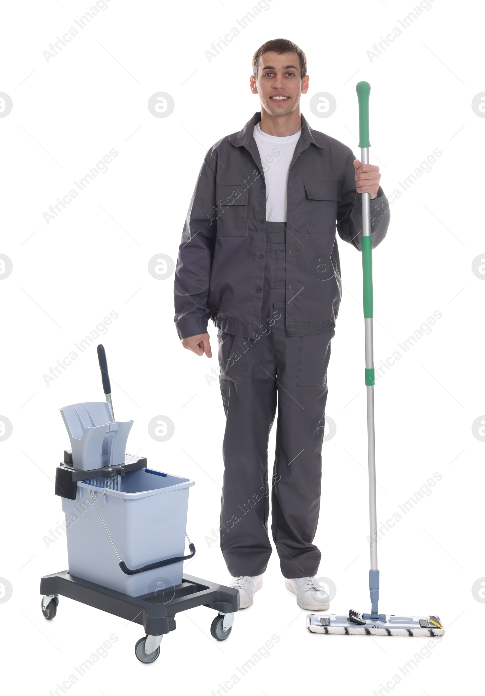 Photo of Smiling cleaning service worker with supplies on white background