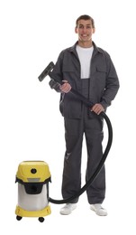 Photo of Smiling cleaning service worker with vacuum cleaner on white background