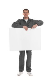 Photo of Smiling cleaning service worker with sheet of paper on white background. Space for text