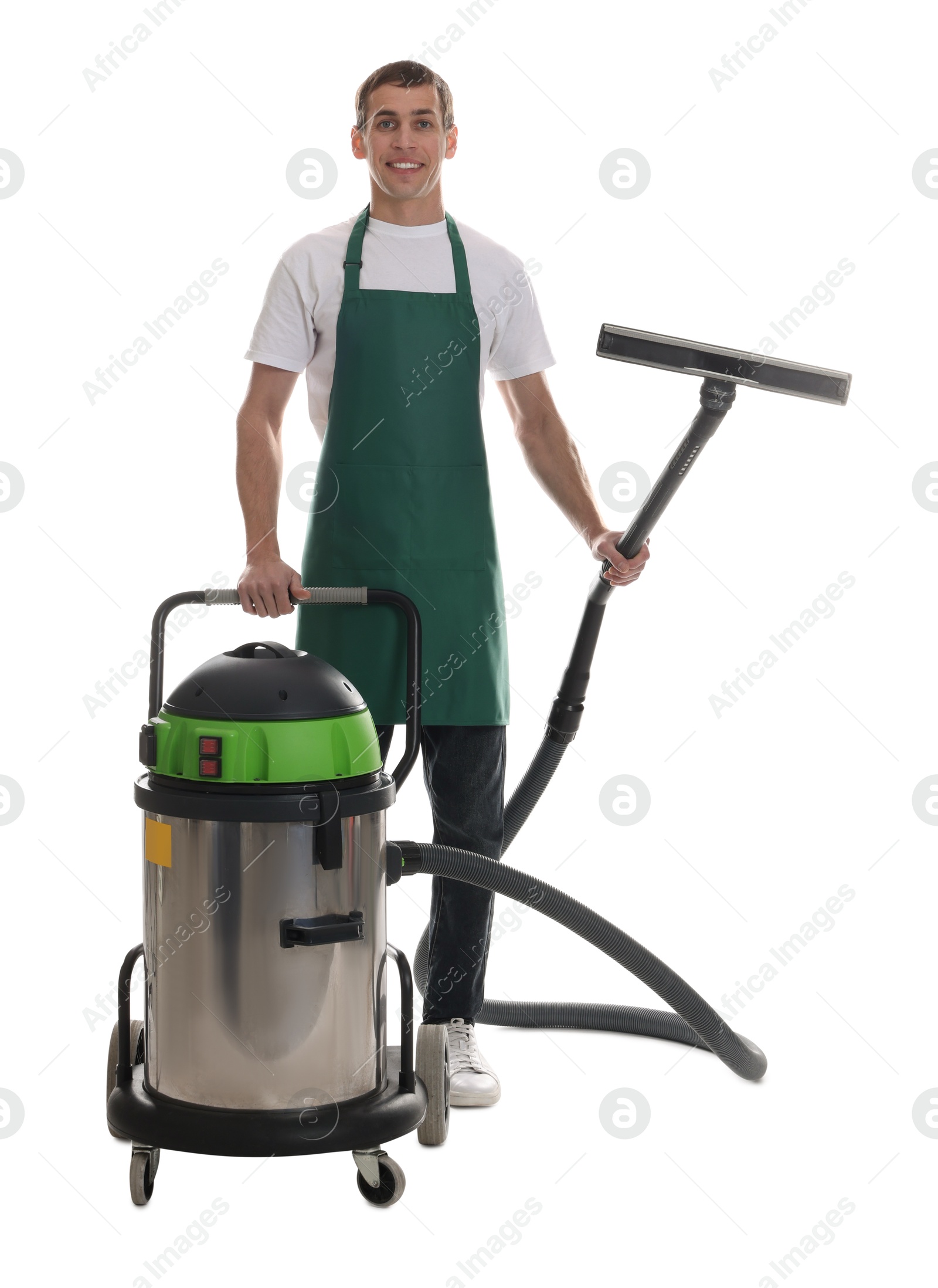 Photo of Smiling cleaning service worker with vacuum cleaner on white background