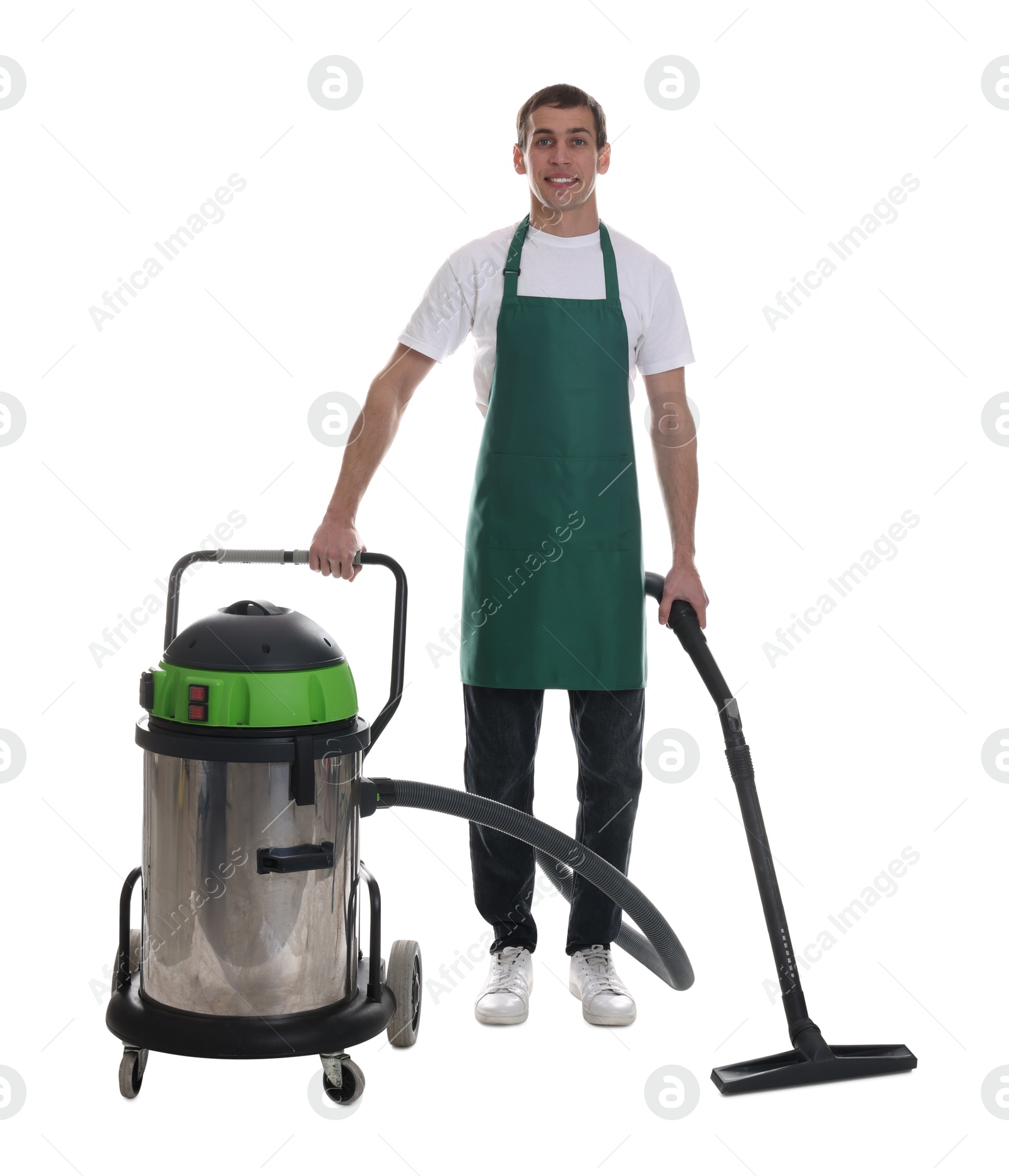 Photo of Smiling cleaning service worker with vacuum cleaner on white background