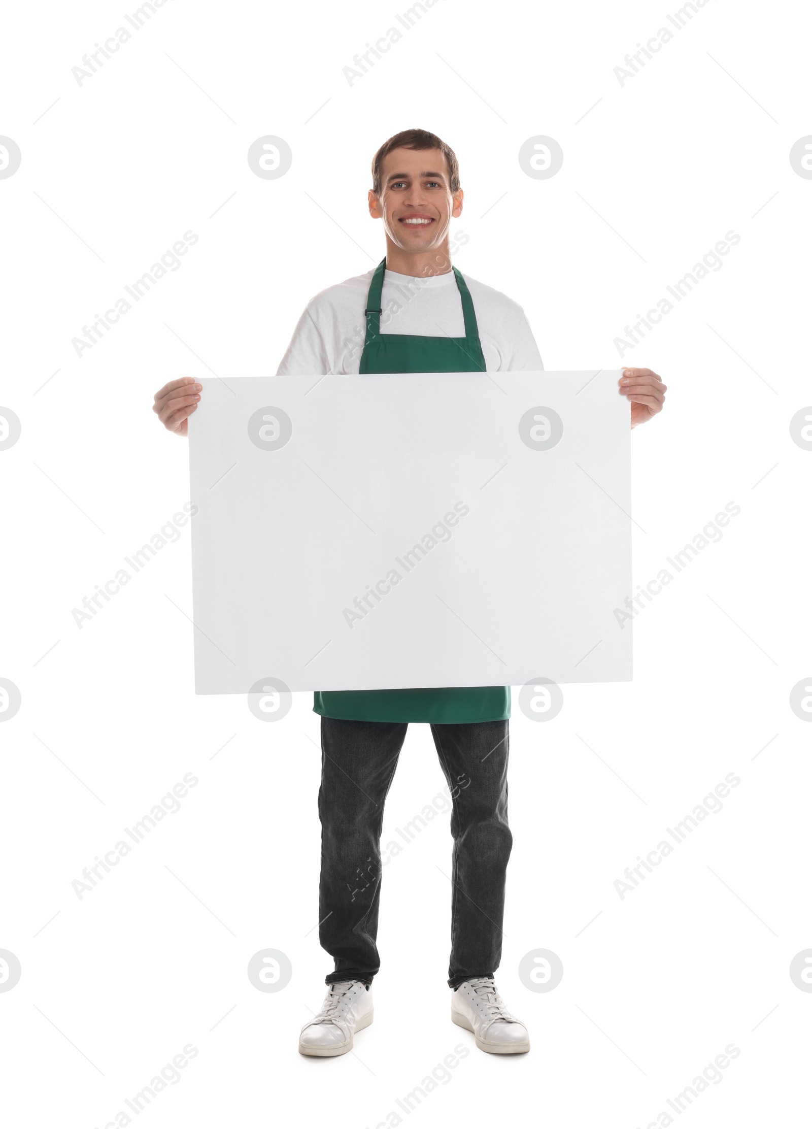 Photo of Smiling cleaning service worker with sheet of paper on white background. Space for text