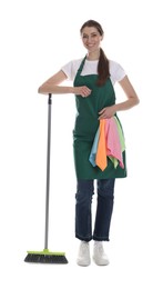 Photo of Smiling cleaning service worker with broom and rags on white background