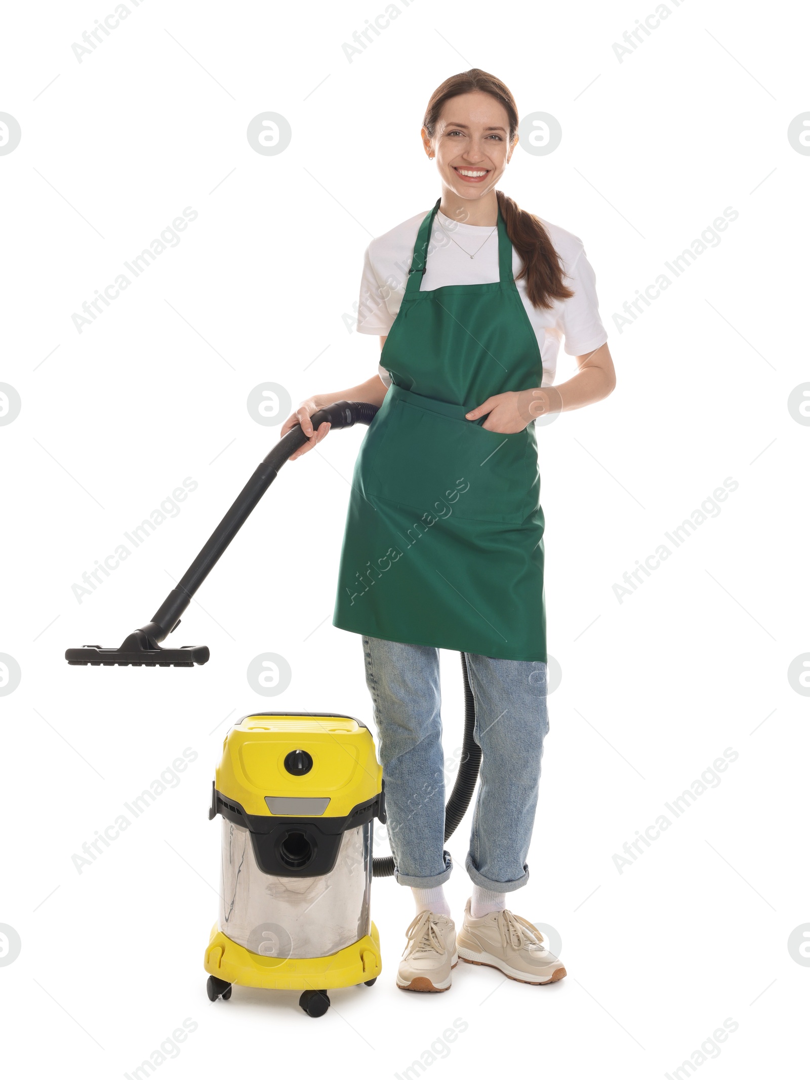 Photo of Smiling cleaning service worker with vacuum cleaner on white background