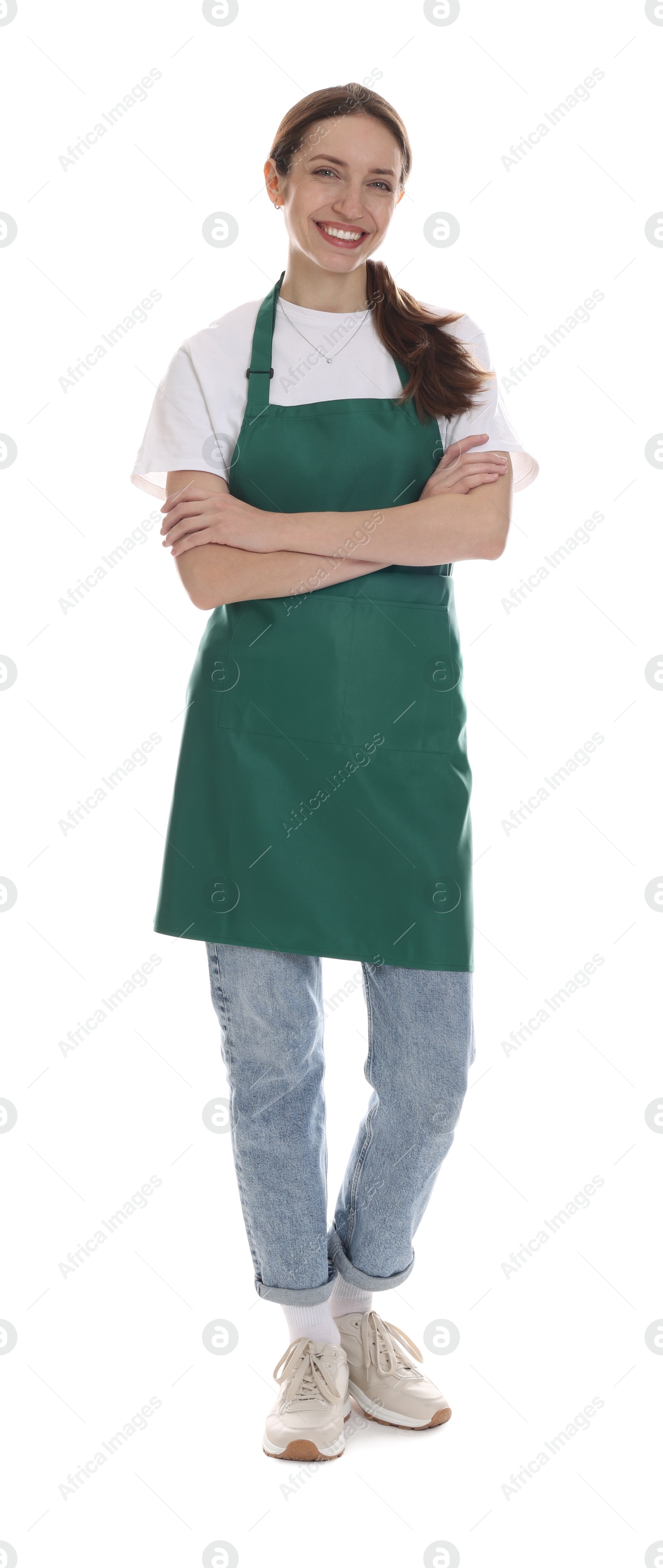 Photo of Smiling cleaning service worker with crossed arms on white background