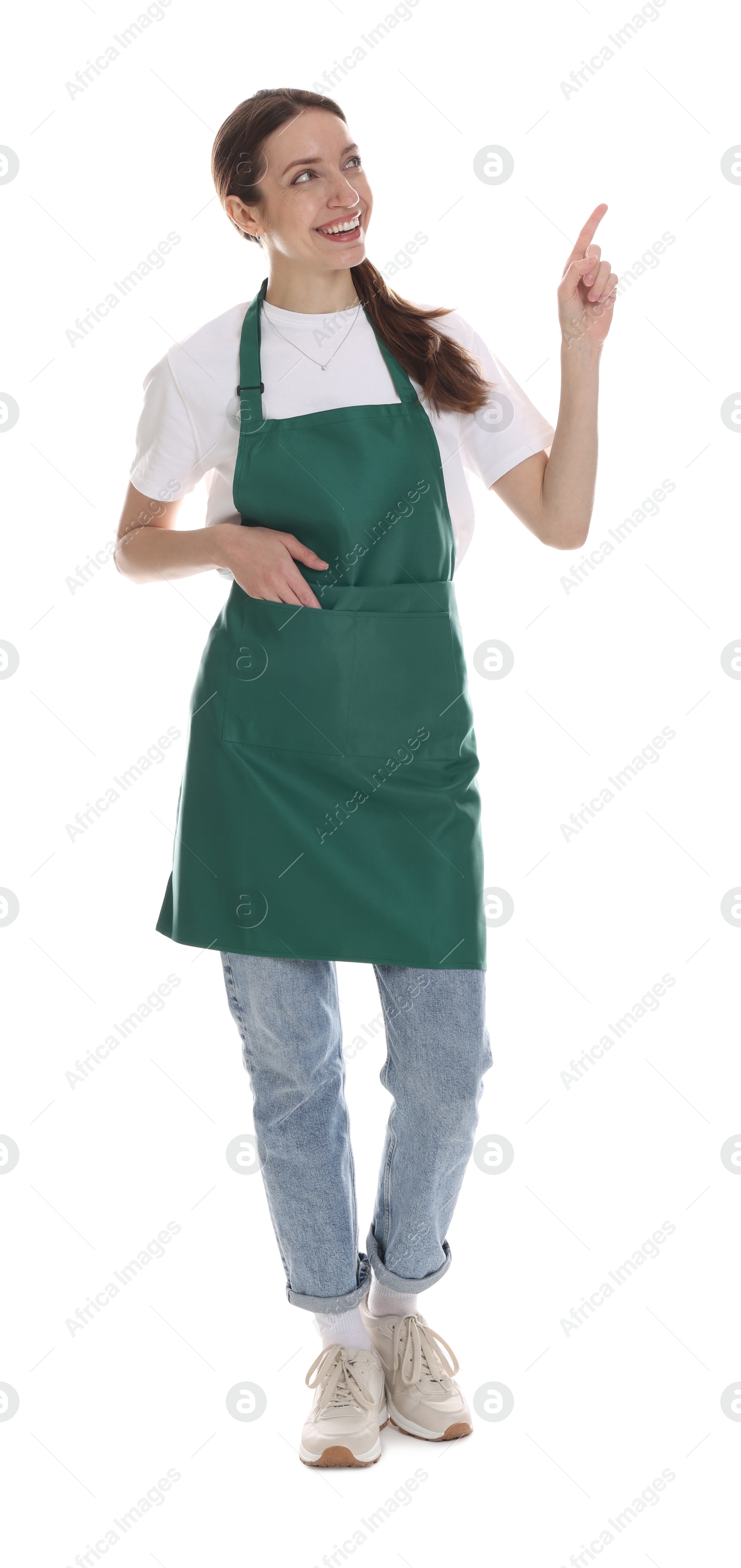 Photo of Smiling cleaning service worker pointing at something on white background