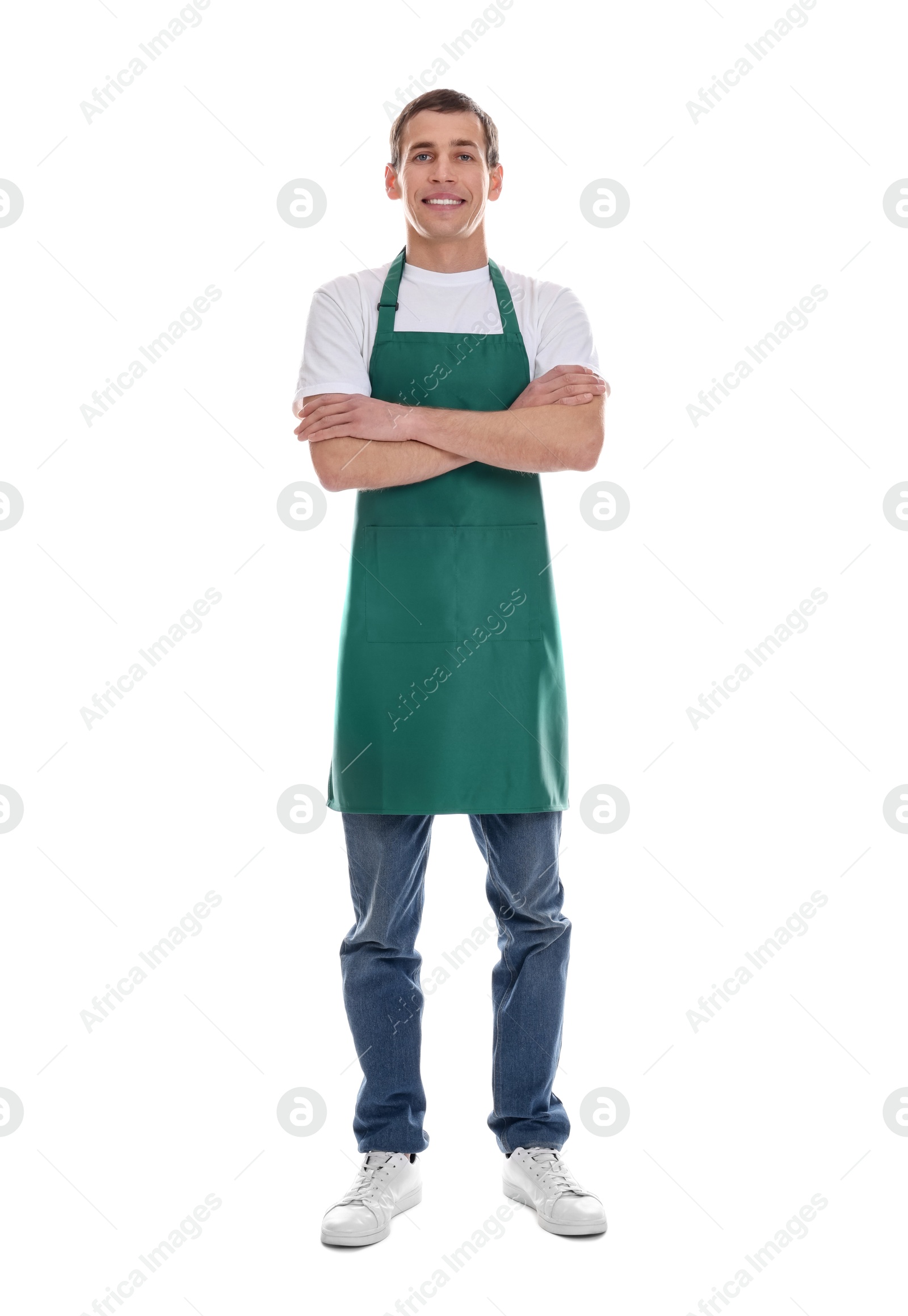 Photo of Smiling cleaning service worker with crossed arms on white background