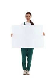 Photo of Smiling cleaning service worker with sheet of paper on white background. Space for text