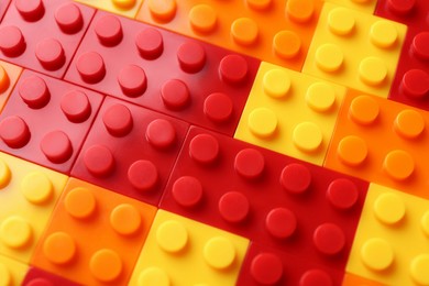 Photo of Constructor toy. Many colorful building blocks as background, top view