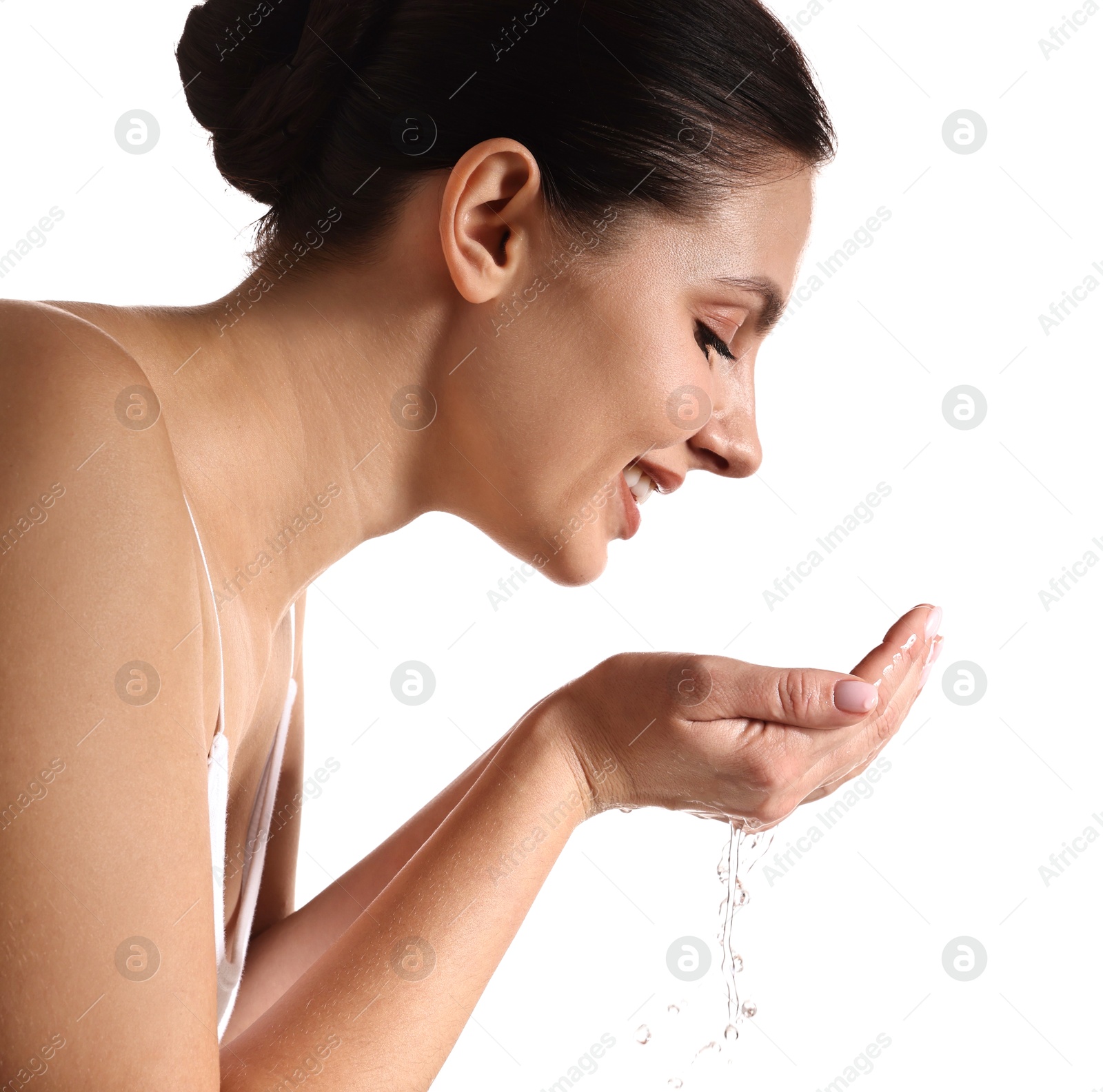 Photo of Smiling woman washing her face on white background