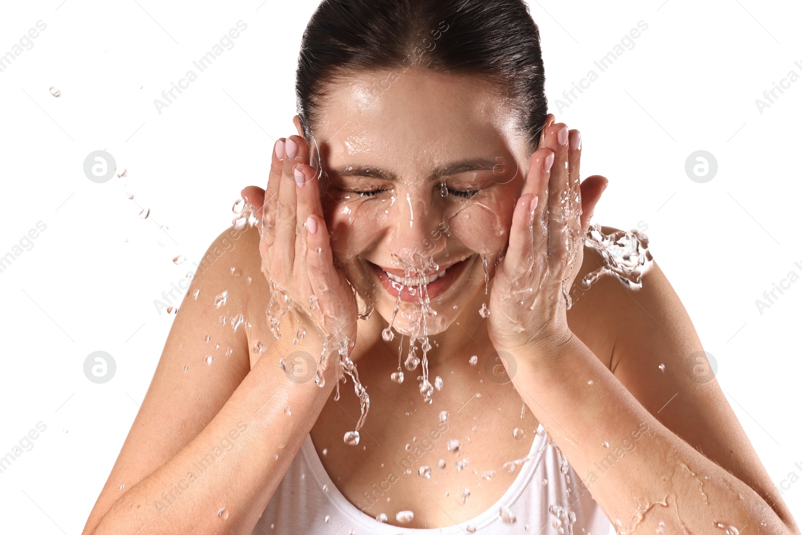 Photo of Smiling woman washing her face on white background