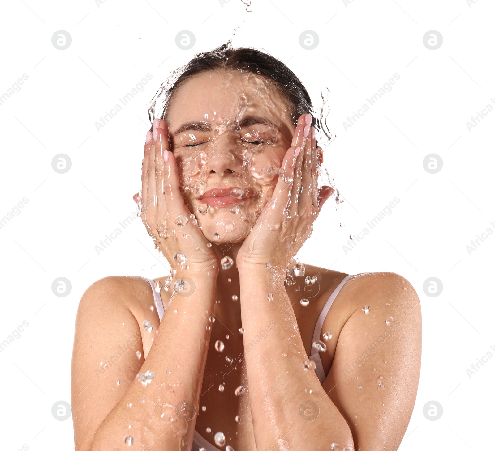 Photo of Attractive woman washing her face on white background