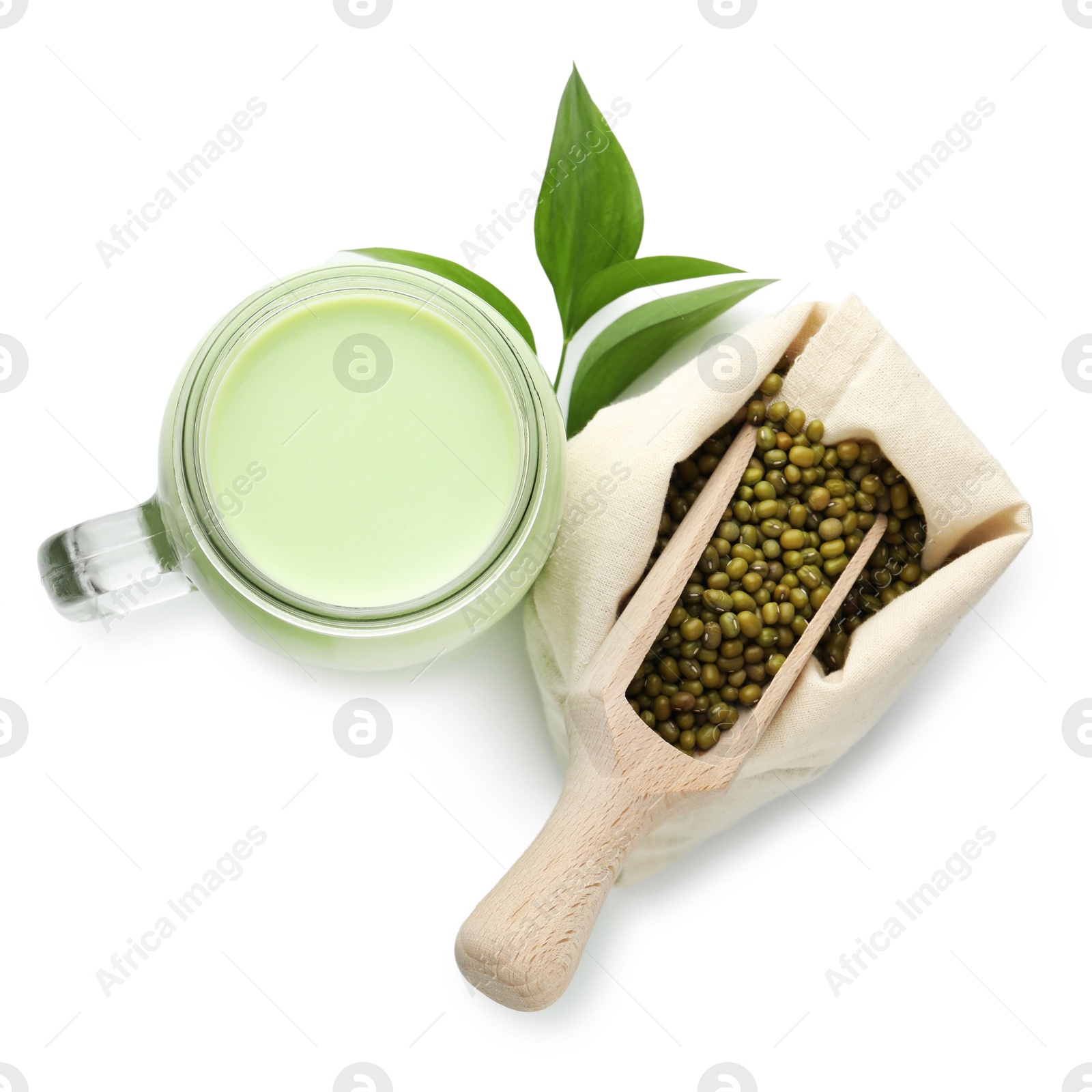 Fresh mung bean juice in mason jar, scoop, seeds and green leaves isolated on white, top view Photo of Fresh mung bean juice in mason jar, scoop, seeds and green leaves isolated on white, top view