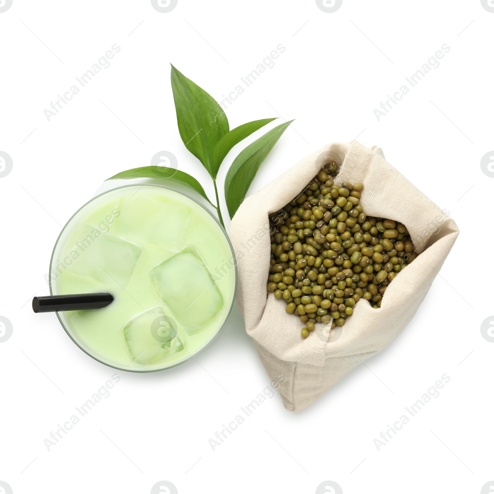 Fresh mung bean juice in glass, seeds and green leaves isolated on white, top view Photo of Fresh mung bean juice in glass, seeds and green leaves isolated on white, top view