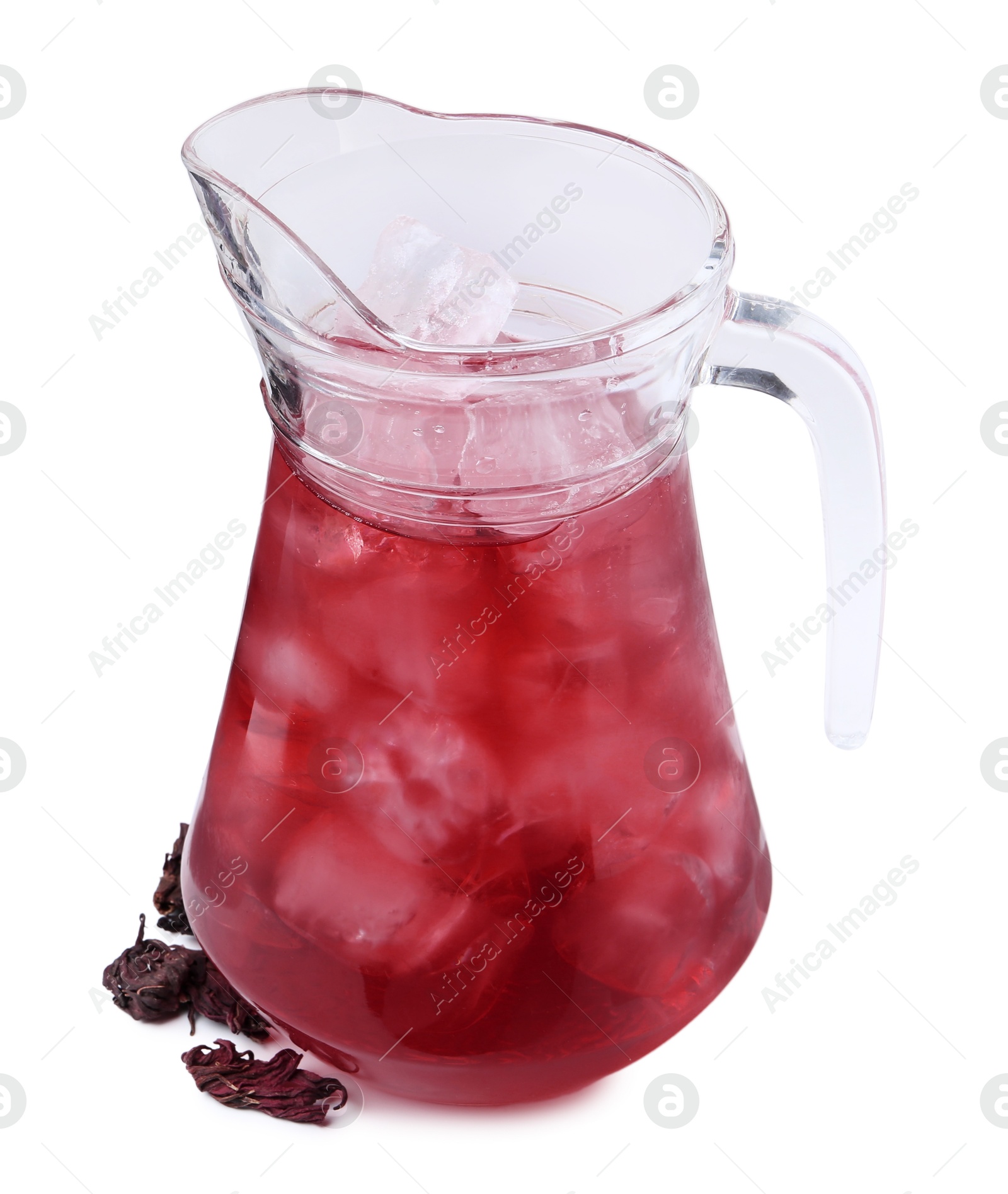 Photo of Delicious hibiscus tea with ice in glass jug and dry roselle sepals isolated on white