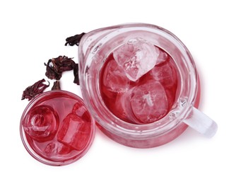 Photo of Delicious hibiscus tea with ice and dry roselle sepals isolated on white, top view