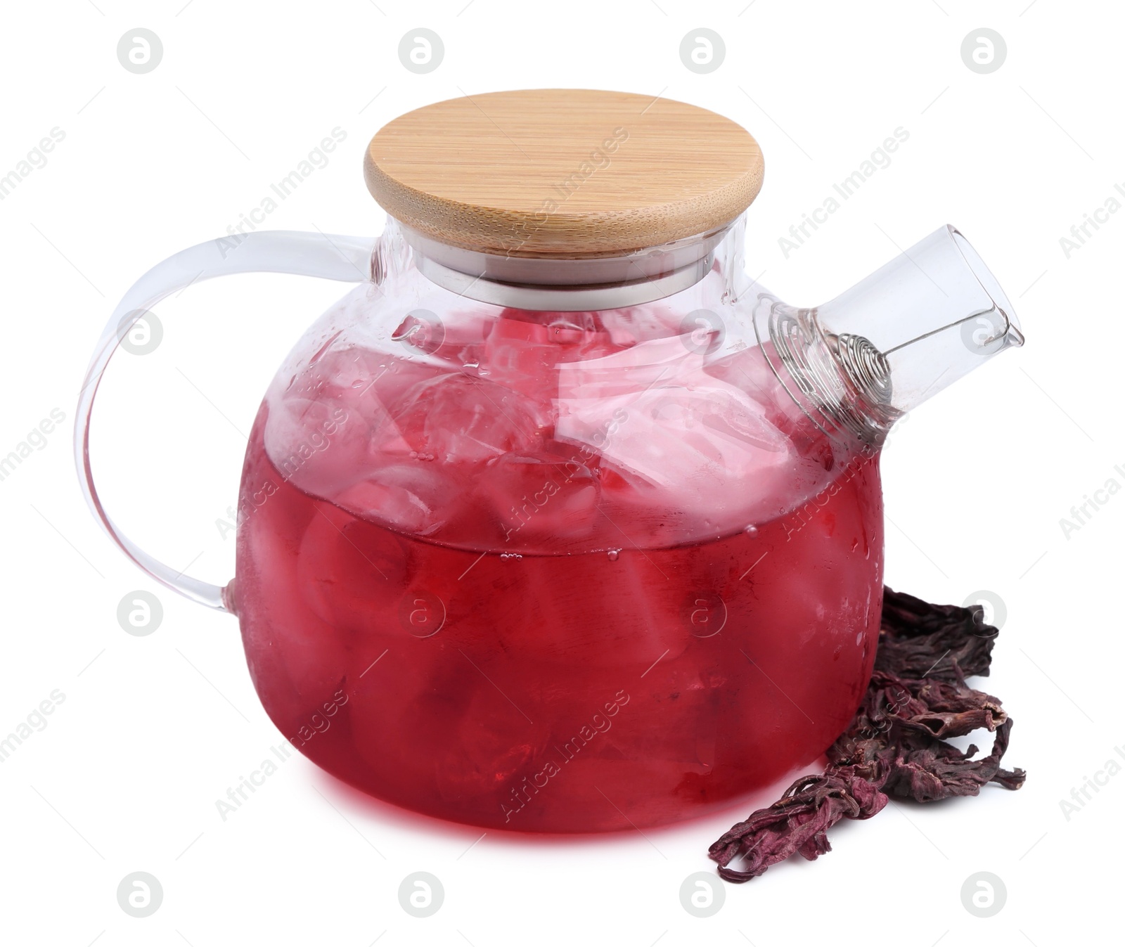 Photo of Delicious hibiscus tea with ice in teapot and dry roselle sepals isolated on white