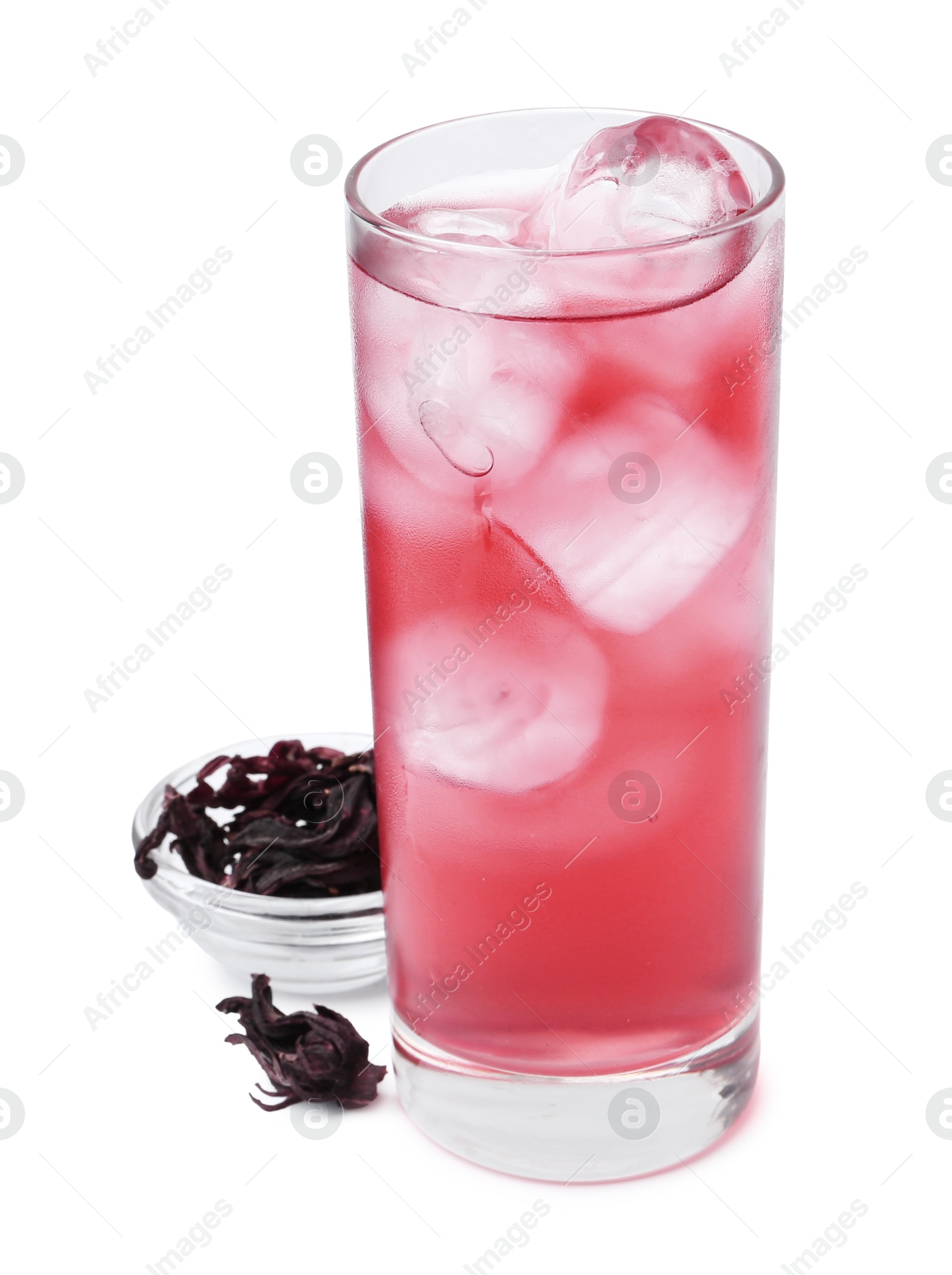 Photo of Delicious hibiscus tea with ice in glass and dry roselle sepals isolated on white