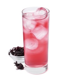 Photo of Delicious hibiscus tea with ice in glass and dry roselle sepals isolated on white