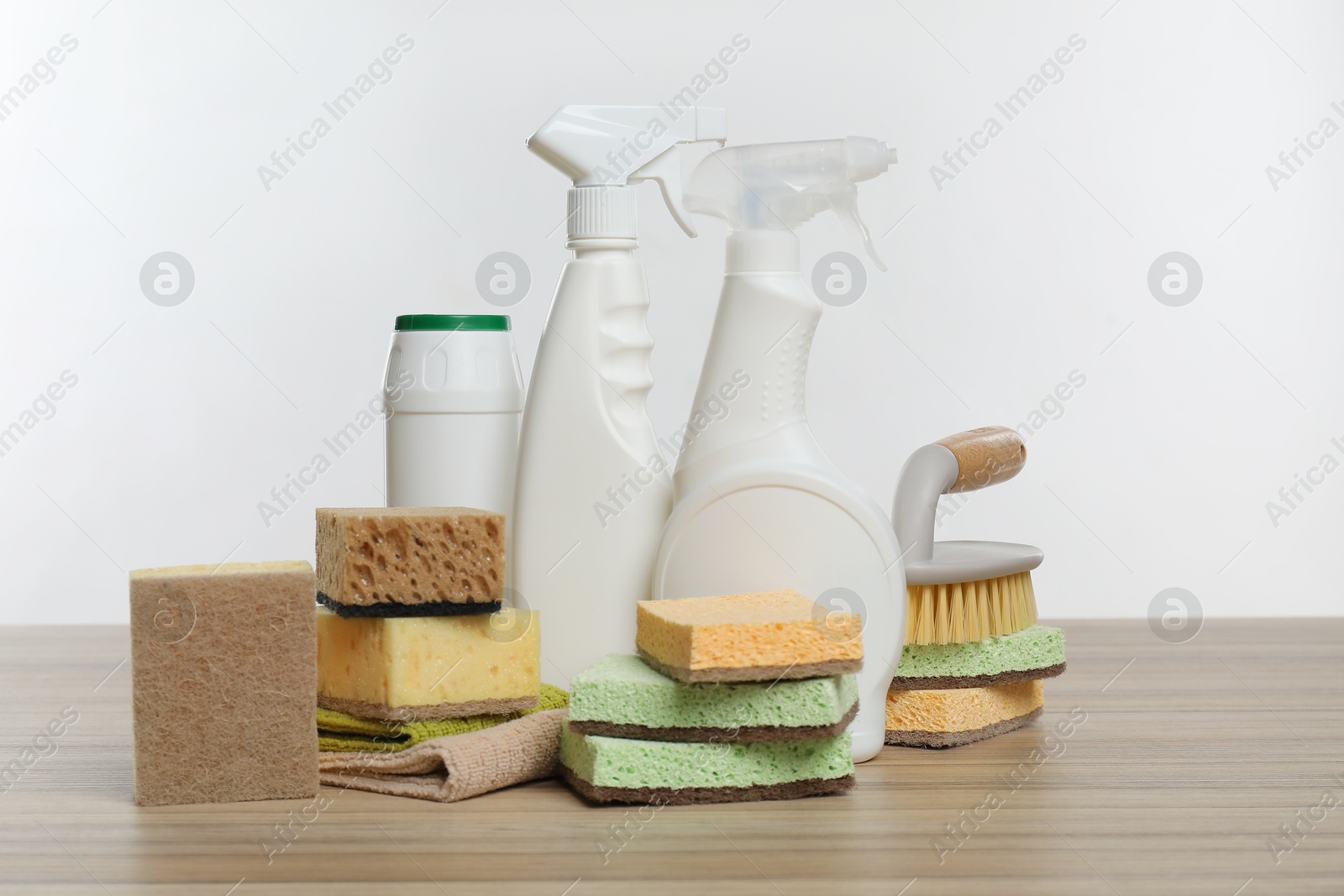 Photo of Eco-friendly cleaning products and supplies on wooden table