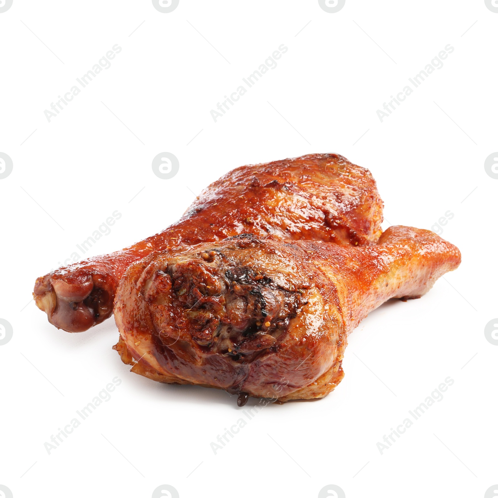 Photo of Delicious baked turkey drumsticks isolated on white