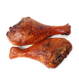 Photo of Delicious baked turkey drumsticks isolated on white, top view