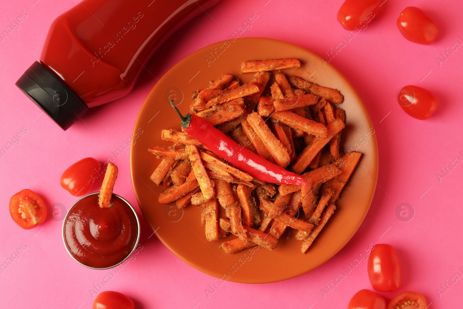 Photo of Tasty ketchup, tomatoes and fried carrots on color background