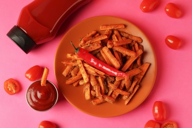 Photo of Tasty ketchup, tomatoes and fried carrots on color background