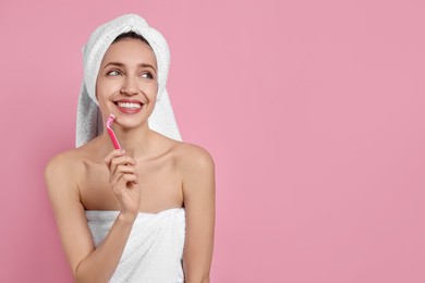 Happy woman shaving her facial hair with razor on pink background. Space for text