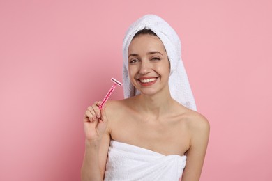 Photo of Happy woman with razor on pink background. Hair removal tool