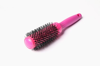 Photo of Hairdresser tool. Round pink brush on white background