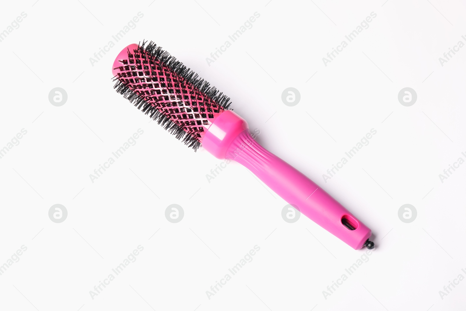 Photo of Hairdresser tool. Round pink brush on white background, top view