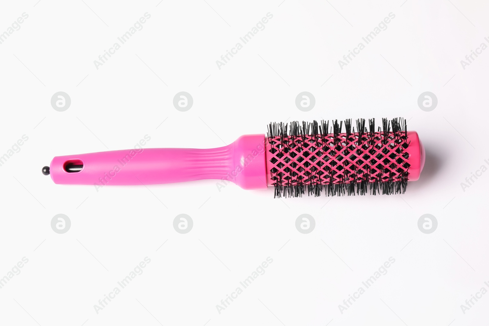 Photo of Hairdresser tool. Round pink brush on white background, top view