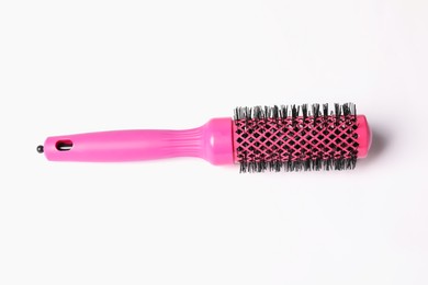 Photo of Hairdresser tool. Round pink brush on white background, top view